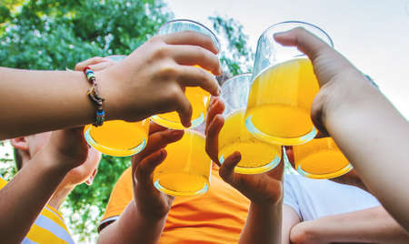 Children are drinking lemonade on the street together. Selective focus. Kids.の写真素材