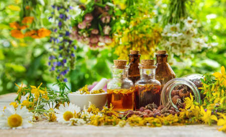 Tincture of medicinal herbs in bottles. Selective focus. Nature.の写真素材