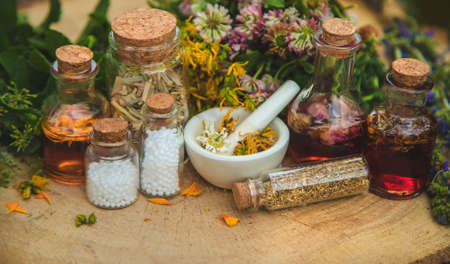Tincture of medicinal herbs in bottles. Selective focus. Nature.の写真素材