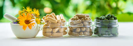 Supplements and vitamins with medicinal herbs. Selective focus. Nature.の写真素材