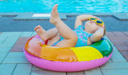Baby with a circle near the pool. Selective focus. Child.の写真素材