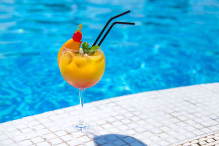 Nice cocktail by the pool. Selective focus. Drink.