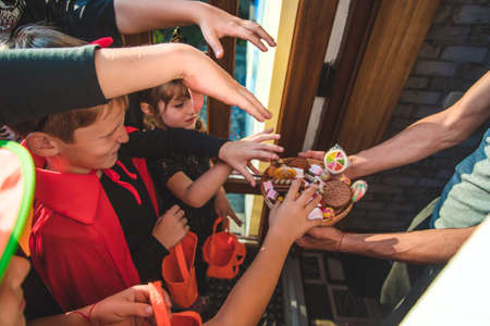 Children celebrate Halloween dressed up in costumes. Selective focus. Kids.