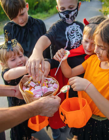 Children celebrate Halloween dressed up in costumes. Selective focus. Kids.の写真素材
