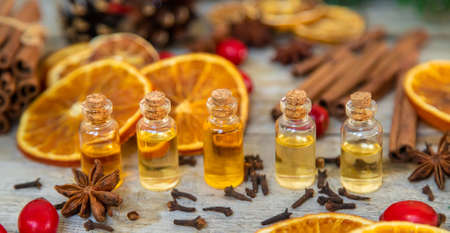 Christmas essential oils in small bottles. Selective focus. Nature.の写真素材