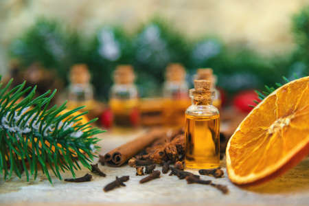 Christmas essential oils in small bottles. Selective focus. Nature.の写真素材