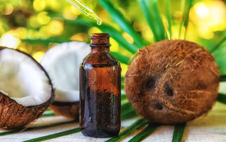 Natural coconut oil in a bottle. Selective focus Nature.の写真素材