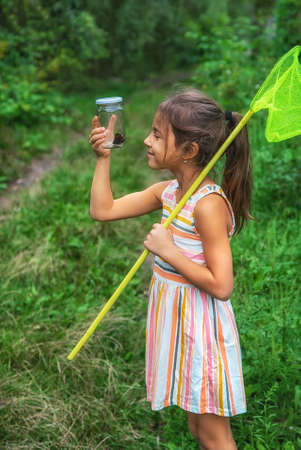 The child catches butterflies in nature. Selective focus. Nature.,の写真素材