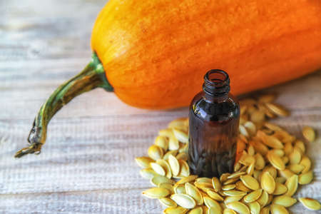 Pumpkin seed oil in a bottle. Selective focus. Nature.の写真素材