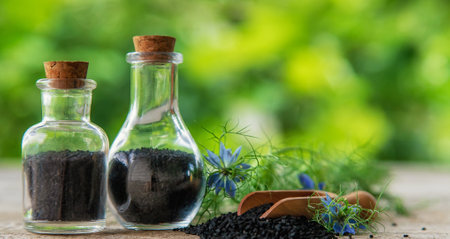 Black cumin oil in a bottle. Selective focus. Nature.の写真素材