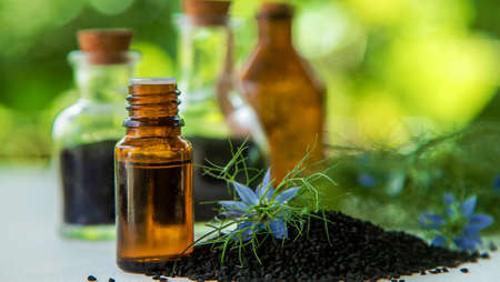 Black cumin oil in a bottle. Selective focus. Nature.の写真素材