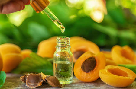 Apricot kernel oil in a bottle. Selective focus. Food.の写真素材