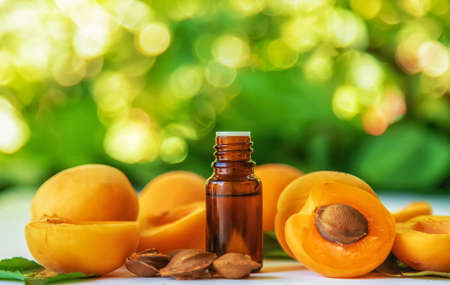 Apricot kernel oil in a bottle. Selective focus. Food.の写真素材