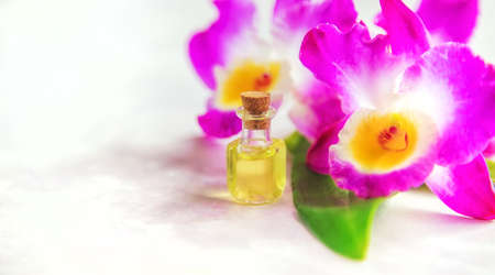 Orchid essential oil in a small bottle. Selective focus. Nature.の写真素材