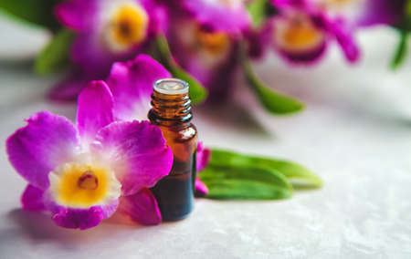 Orchid essential oil in a small bottle. Selective focus. Nature.の写真素材