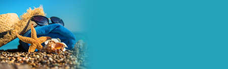 Accessories on the beach by the sea. Selective focus. Travel.の写真素材