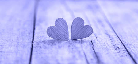 Wooden hearts for Valentine's day congratulation. very peri, Color of the year, 2022, blue, purple,...