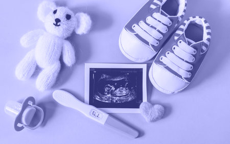 Ultrasound picture of a baby's photograph and accessories. very peri, Color of the year, 2022, blue, purple, Selective focus. child.の写真素材