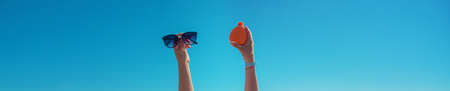Sunscreen in the hands of a woman. Selective focus. Nature.の写真素材