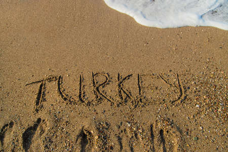 The inscription Turkey on the sand on the beach. Selective focus. Nature.の写真素材