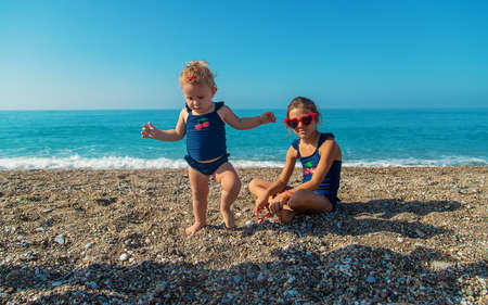 Children in sunglasses on the beach. Selective focus. Kids.