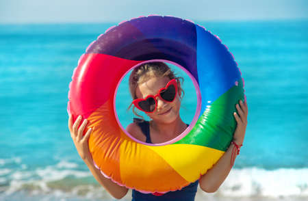 Children on the beach with a circle. Selective focus. Kid.