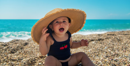 Baby with a hat on the beach. Selective focus. Child.の写真素材