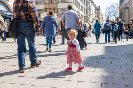 Munich Germany - April 15, 2022, people on a walk. selective focus. Nature.のeditorial素材