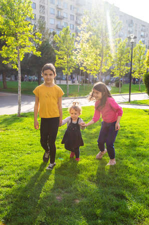 Children walk together in a friend's folder. selective focus. kids.の写真素材