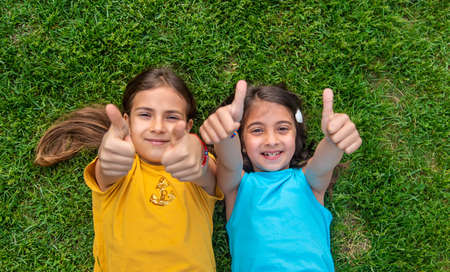 Children girls girlfriends in the park. selective focus. kids.の写真素材