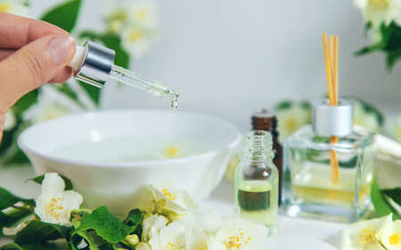 Spa salon background jasmine oil. Selective focus.の写真素材