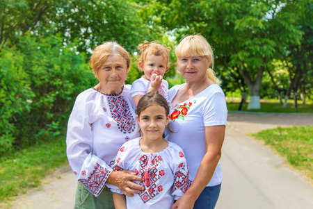 Family photo of a Ukrainian woman in embroidered shirts. Selective focus.の写真素材