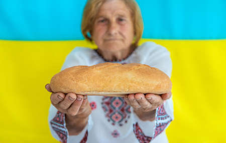 Grandmother is a Ukrainian patriot in an embroidered shirt. selective focus.の写真素材