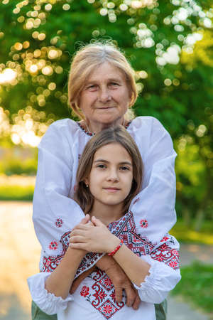 Ukrainian grandmother and granddaughter in vyshyvanka. selective focus.の写真素材