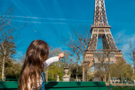 Children in Paris near the Eiffel Tower. Selective focus.の写真素材