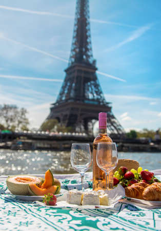 Picnic and wine near the Eiffel Tower. selective focus. food.