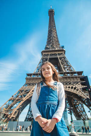 Child in Paris near the Eiffel Tower. selective focus. kid.の写真素材