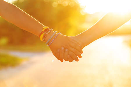 Children walk hand in hand. selective focus. kids,の写真素材