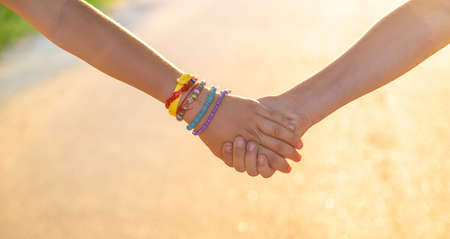 Children walk hand in hand. selective focus. kids,の写真素材