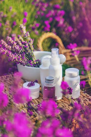 Lavender cosmetics in a field with flowers. selective focus. Nature.の写真素材