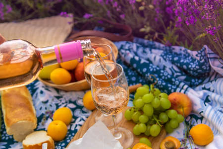 Wine in a lavender field. selective focus. food.