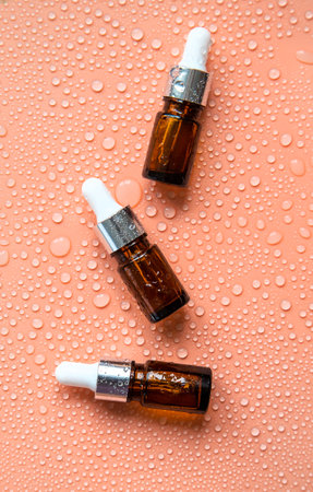 Bottle of cosmetics and drops of liquid, moisturizing. hyaluronic acid. selective focus. Spa.
