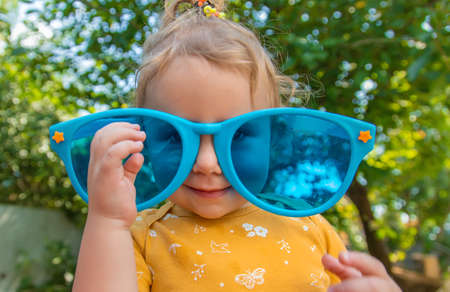 Children enjoy nature in glasses. selective focus. Nature.