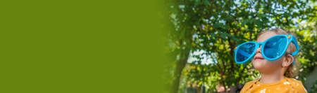 Children enjoy nature in glasses. selective focus. Nature.の写真素材