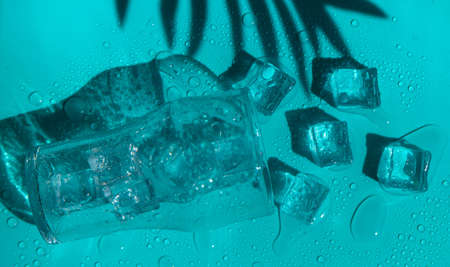 Ice cubes in a glass. selective focus. blue.