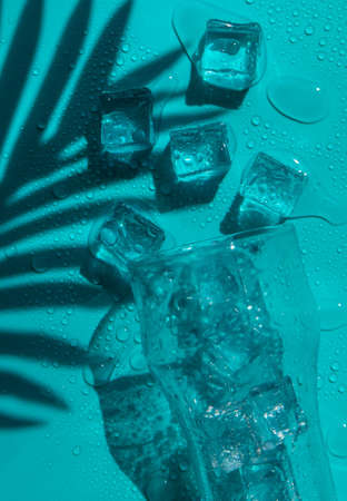 Ice cubes in a glass. selective focus. blue.