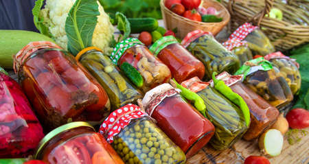 Jars with preserved vegetables for the winter. Selective focus.の写真素材