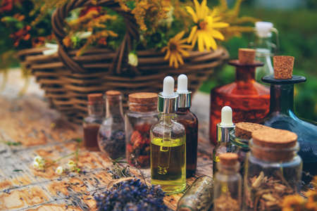 Medicinal herbs and tinctures on the table. selective focus. Nature.の写真素材