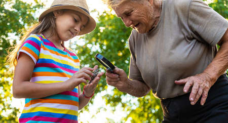 The child is playing with the frog. Selective focus.の写真素材