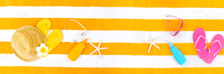 Beach towel with relaxation accessories. Selective focus.の写真素材